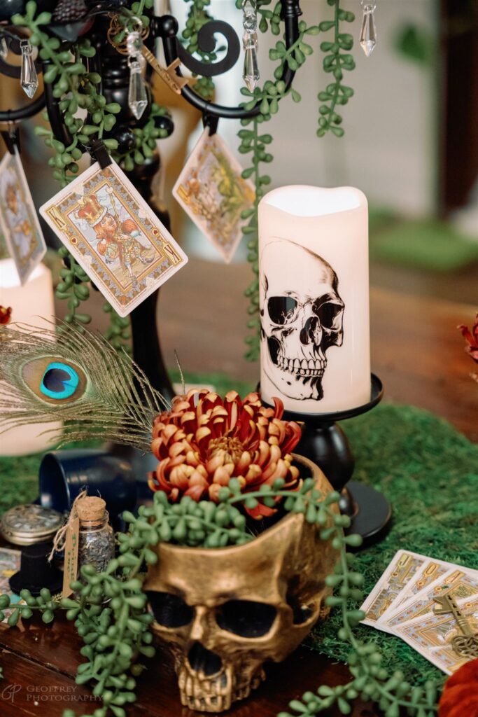Halloween table decor with skull candle and tarot cards