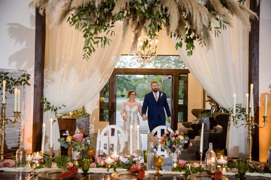 Bride and groom entering reception space together
