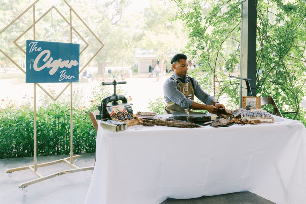 Cigar rolling station setup at wedding reception