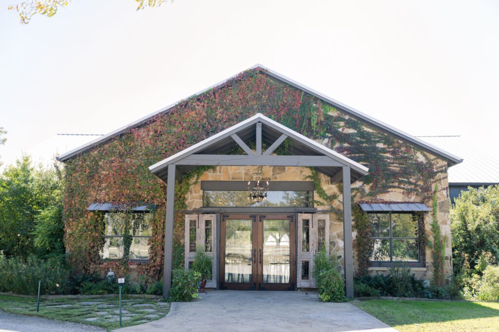 Stone wedding venue surrounded by greenery