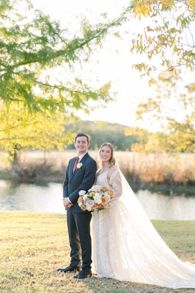 Newlyweds beside the pond