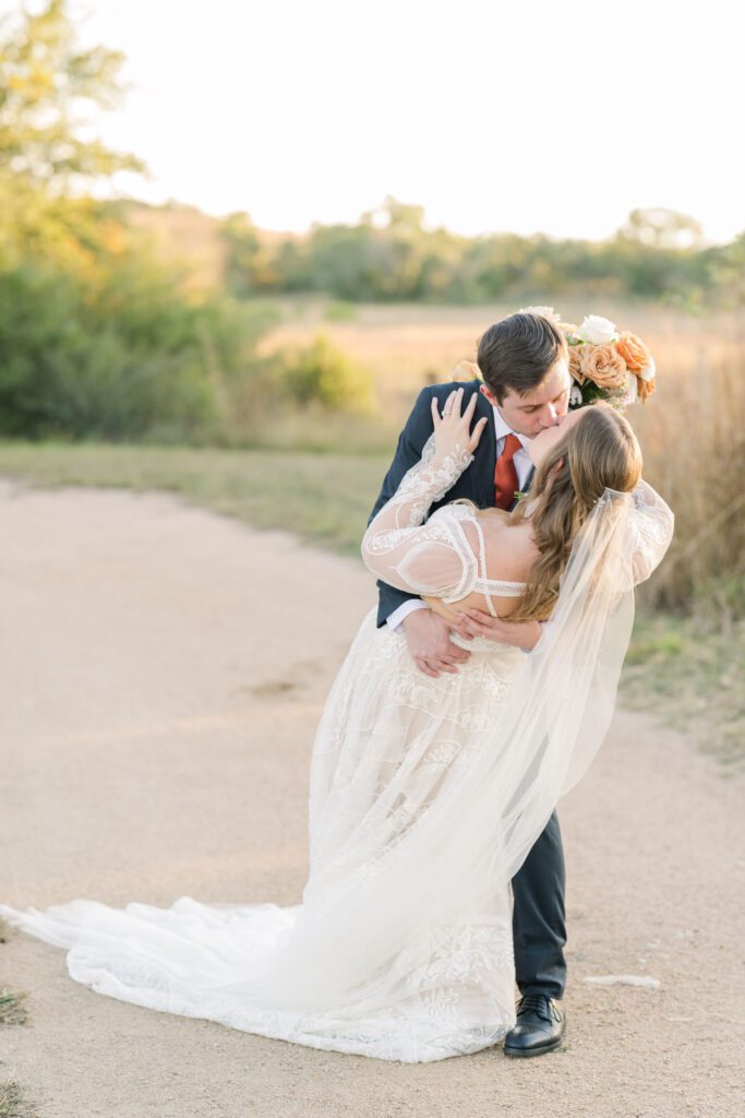 Groom dipping and kissing the bride