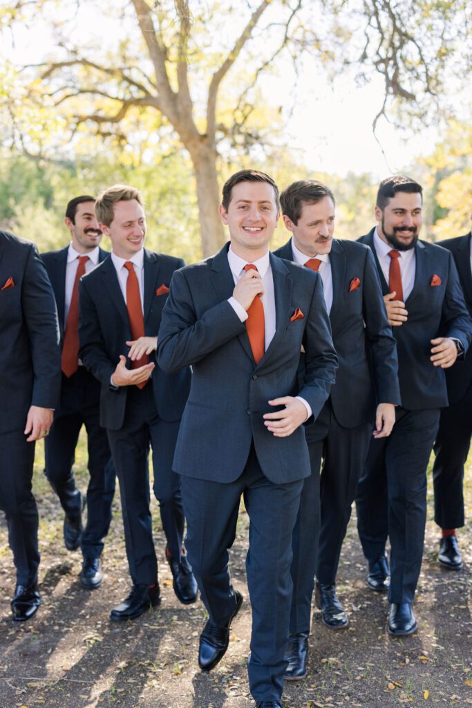 Groom walking with his groomsmen
