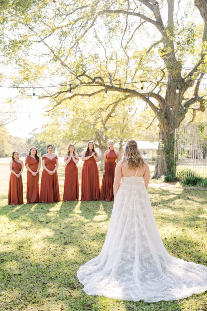 Bride seeing her bridesmaids before the ceremony