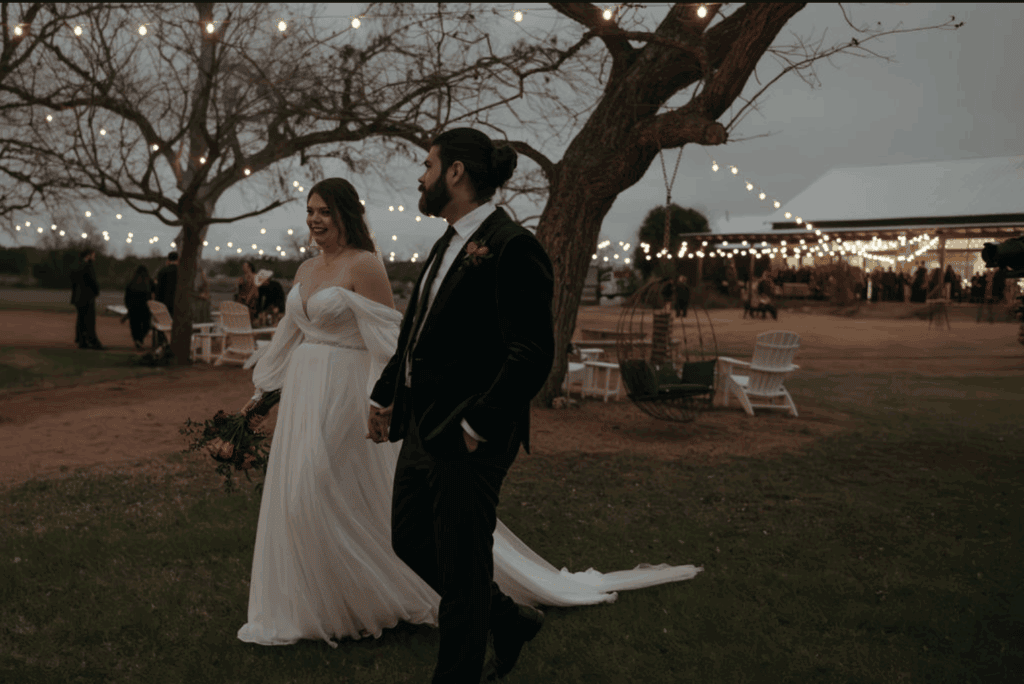 Bride and groom walking in an Austin Wedding Venue